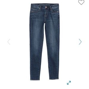 Straight legged dark blue jeans